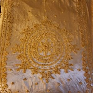 Satin golden yellow king size bedspread, approximately 96" by 96"